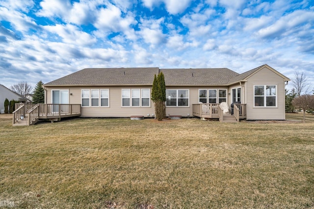 back of house with a lawn and a wooden deck