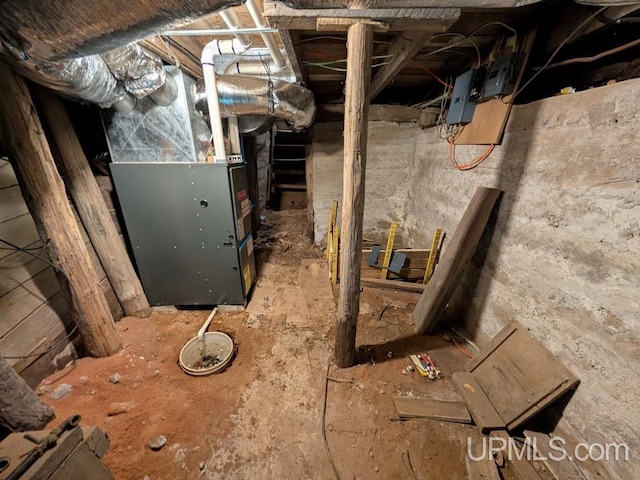 utility room featuring heating unit