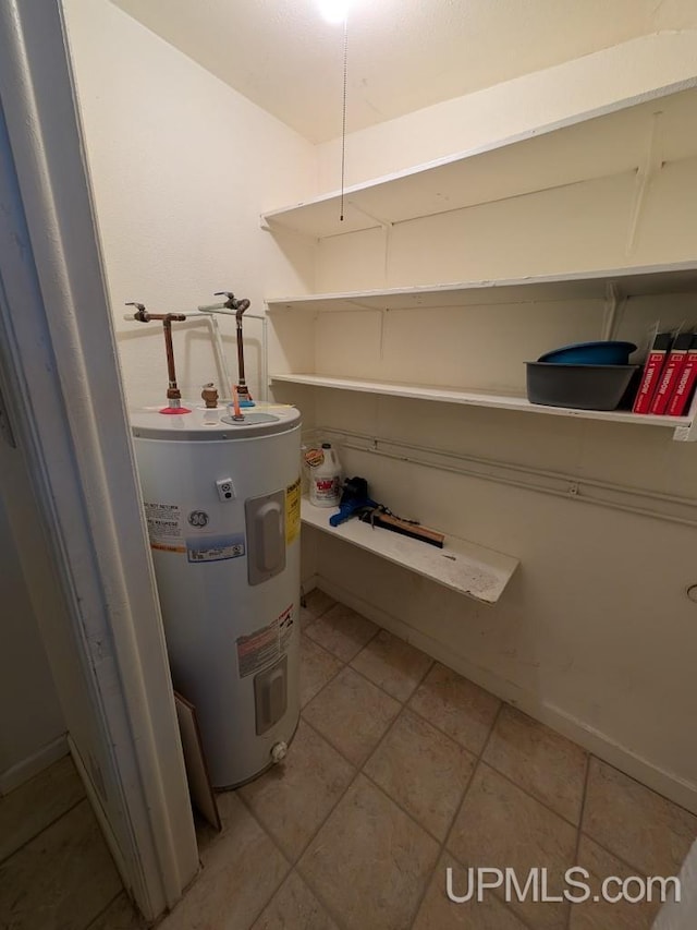 utility room with electric water heater