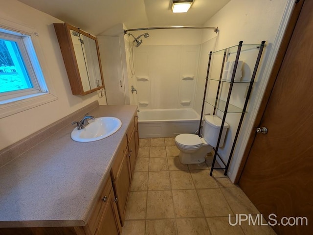 full bath featuring vanity, toilet, washtub / shower combination, and tile patterned flooring