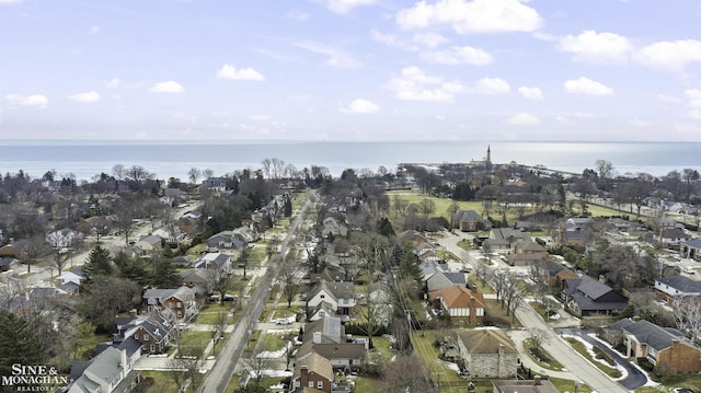 birds eye view of property featuring a residential view and a water view