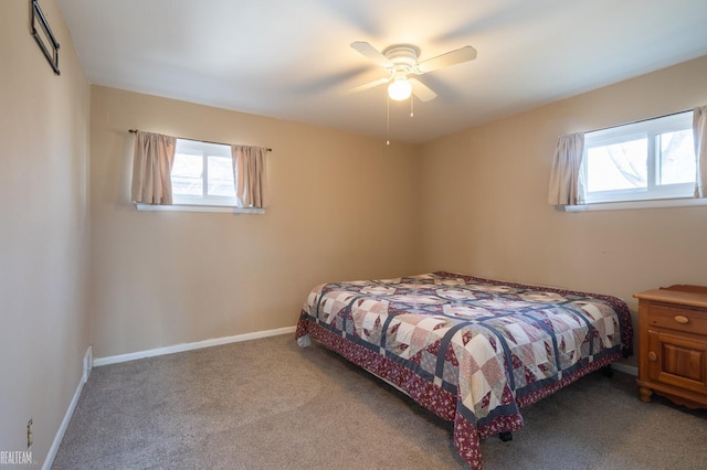 bedroom featuring a ceiling fan, carpet, and baseboards