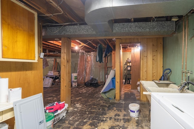 unfinished basement featuring washer / clothes dryer