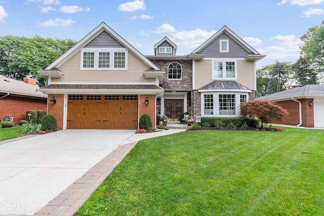 view of front of property with concrete driveway, a front lawn, french doors, a garage, and brick siding