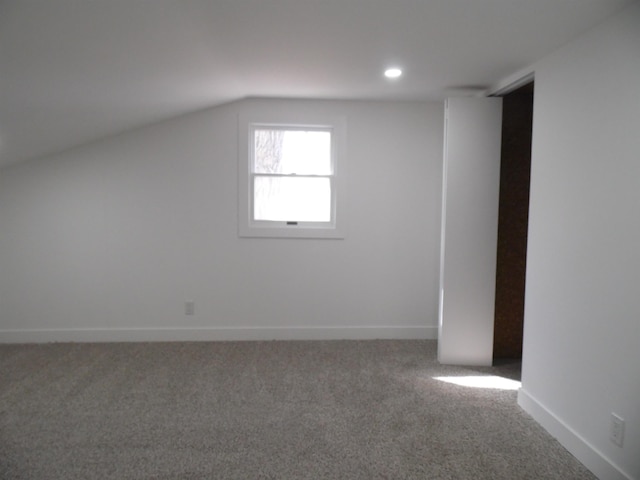 additional living space with recessed lighting, baseboards, carpet, and vaulted ceiling