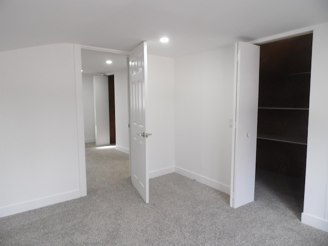 interior space with recessed lighting, baseboards, and carpet floors