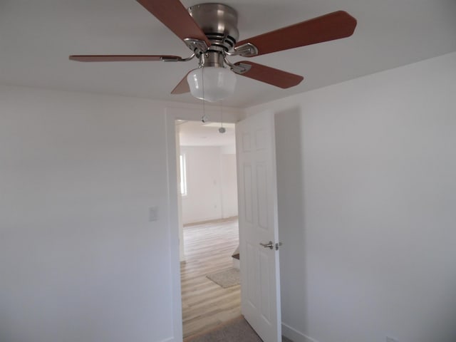 interior space with baseboards and wood finished floors