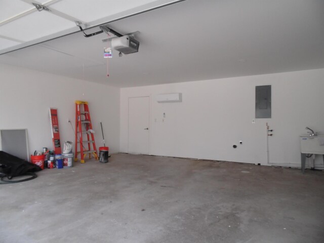 garage with electric panel, a garage door opener, and a sink