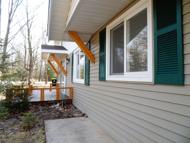 view of side of home with a porch