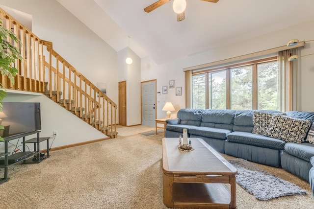 living room with baseboards, stairs, carpet flooring, high vaulted ceiling, and a ceiling fan