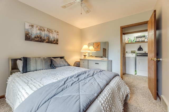 carpeted bedroom with washer and clothes dryer, visible vents, baseboards, and ceiling fan