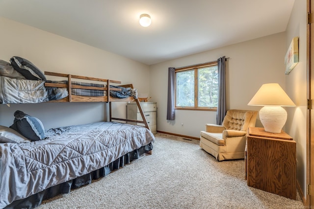 bedroom featuring carpet flooring, visible vents, and baseboards