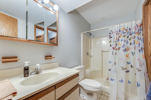 bathroom featuring toilet, a stall shower, and vanity