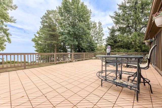 view of patio / terrace featuring outdoor dining area and a water view