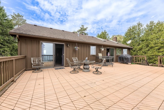 deck featuring area for grilling and a patio