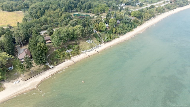 drone / aerial view with a beach view and a water view