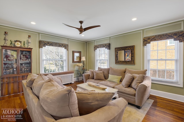 living room with baseboards, ornamental molding, recessed lighting, wood finished floors, and a ceiling fan