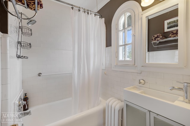 full bath with shower / tub combo with curtain, tile walls, and radiator heating unit