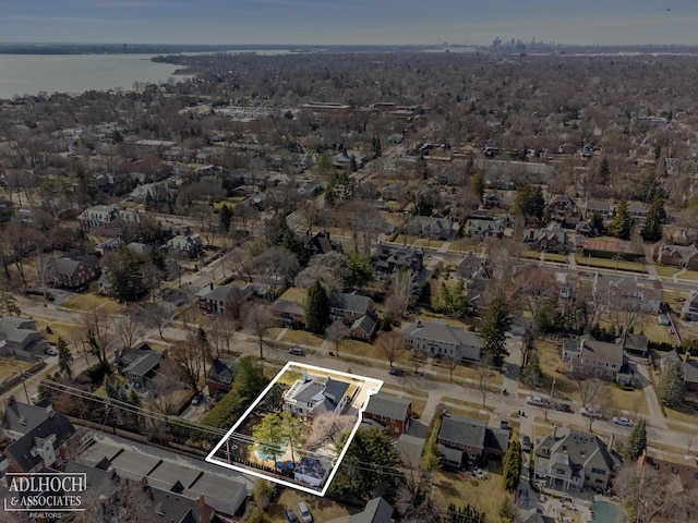 birds eye view of property with a residential view and a water view