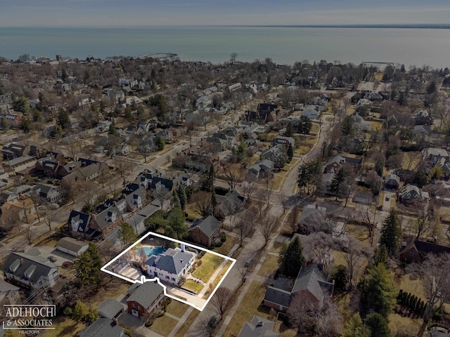 birds eye view of property with a residential view and a water view