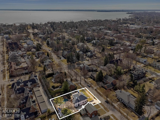 bird's eye view featuring a water view and a residential view