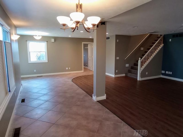 interior space with visible vents, stairs, and baseboards