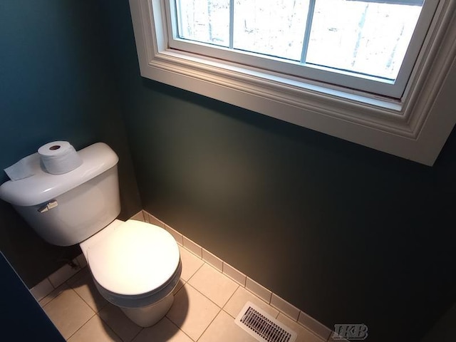 bathroom with tile patterned floors, toilet, and visible vents