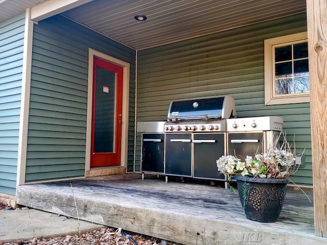 view of exterior entry featuring area for grilling