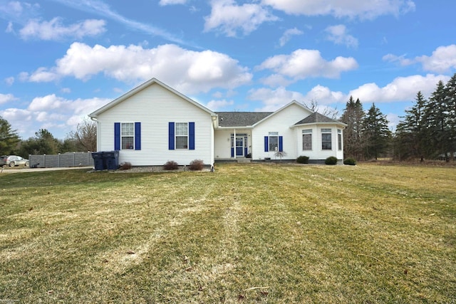 ranch-style house featuring a front lawn