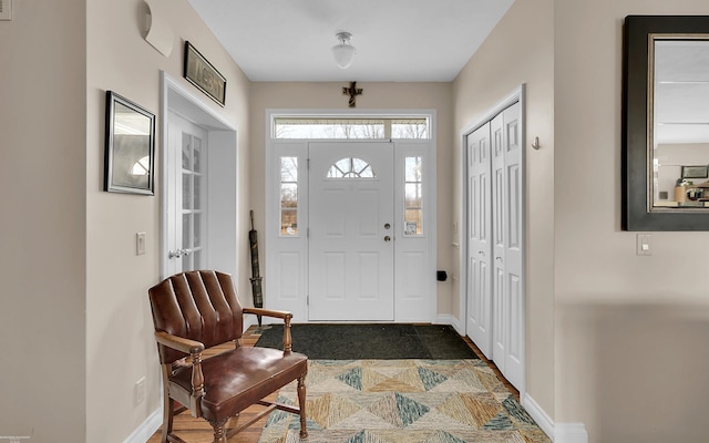 entryway featuring baseboards