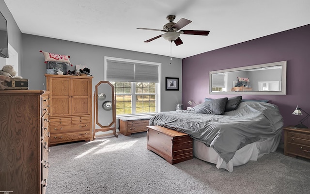 bedroom featuring baseboards, a ceiling fan, and carpet floors