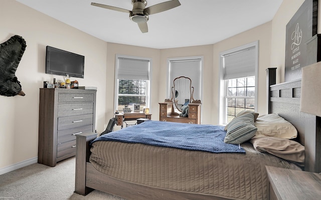 bedroom featuring ceiling fan, baseboards, and carpet floors