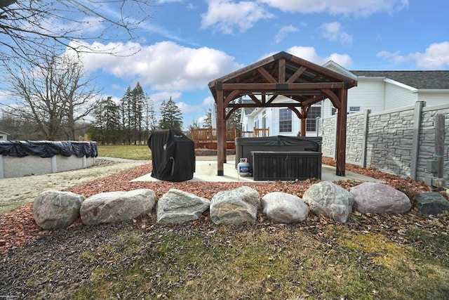 view of yard with a covered pool, a patio, a fenced backyard, a gazebo, and a hot tub