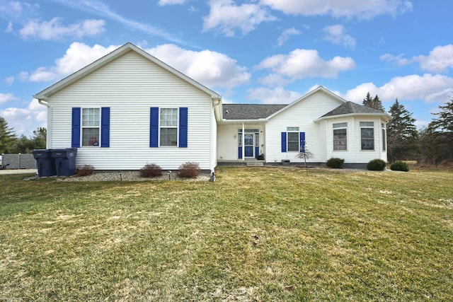 ranch-style home featuring a front lawn