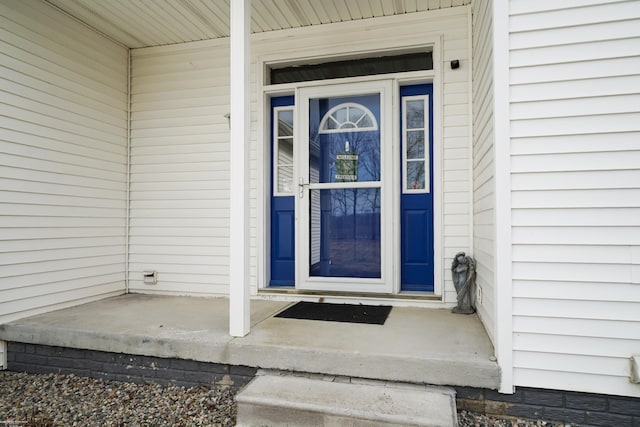 doorway to property featuring covered porch