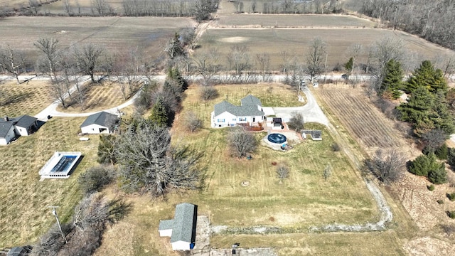 birds eye view of property with a rural view