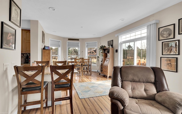 dining area featuring a healthy amount of sunlight and light wood-style floors