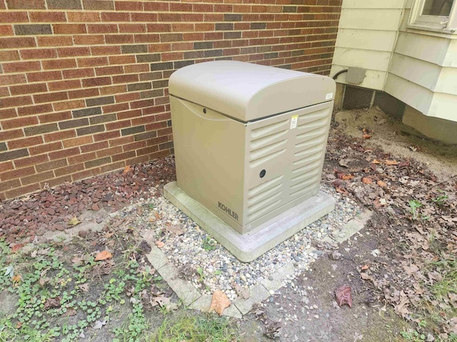 details featuring brick siding and a power unit