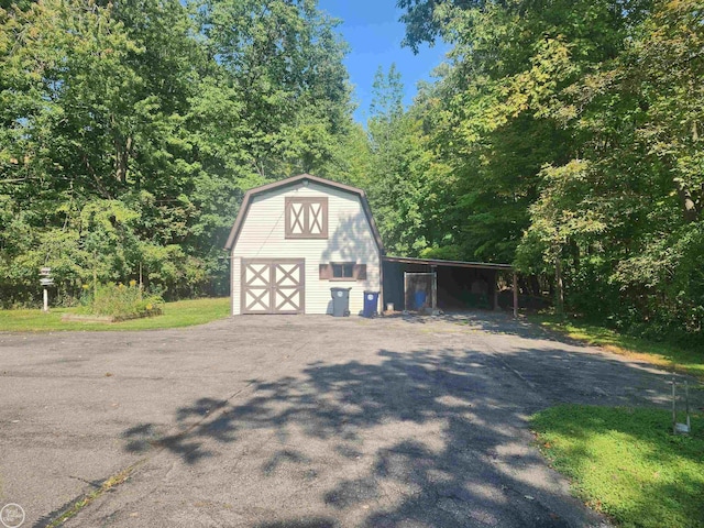 exterior space with a carport and driveway