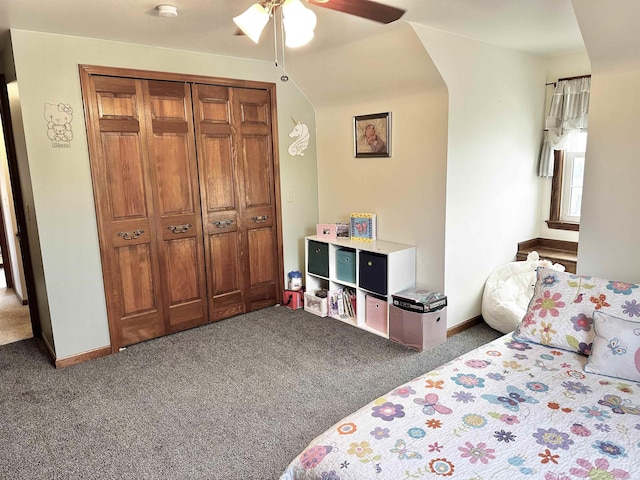 carpeted bedroom featuring a ceiling fan, baseboards, and a closet