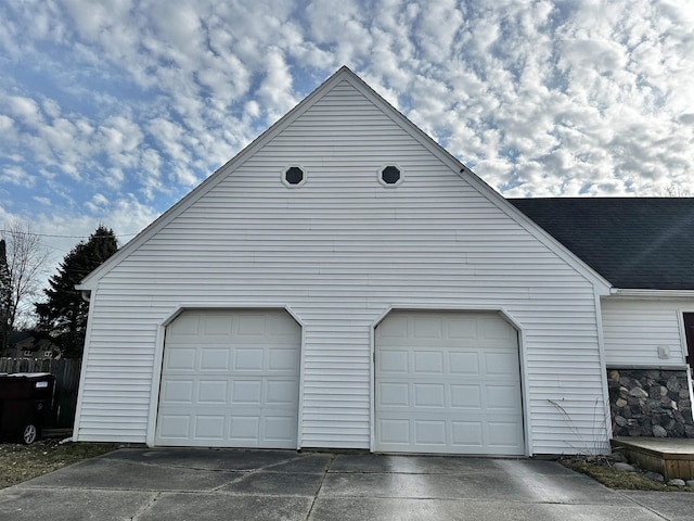 garage with concrete driveway