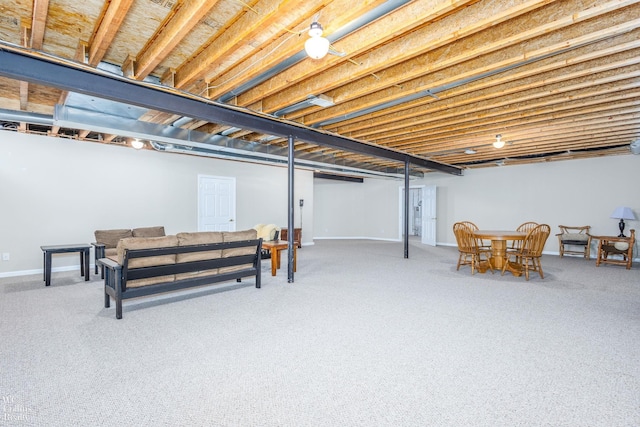 finished basement featuring baseboards and carpet