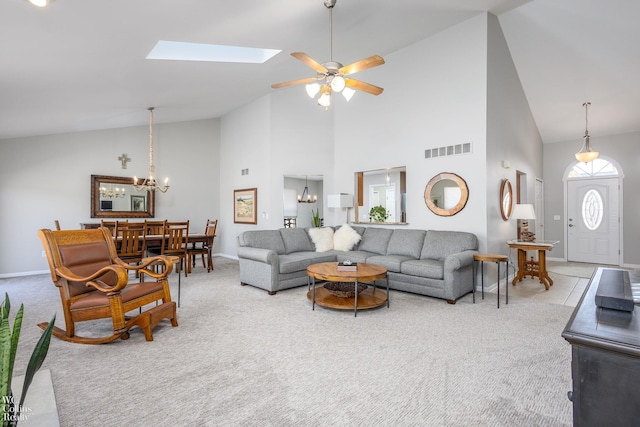 living area with visible vents, baseboards, and carpet flooring