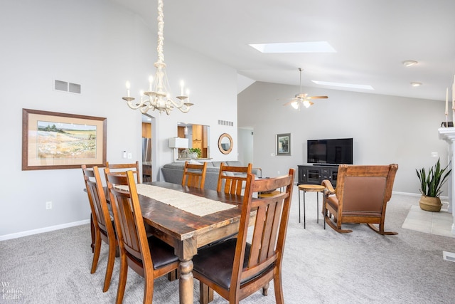 dining area featuring a skylight, light colored carpet, and visible vents