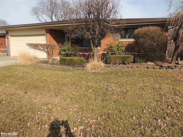 single story home with brick siding, an attached garage, concrete driveway, and a front lawn