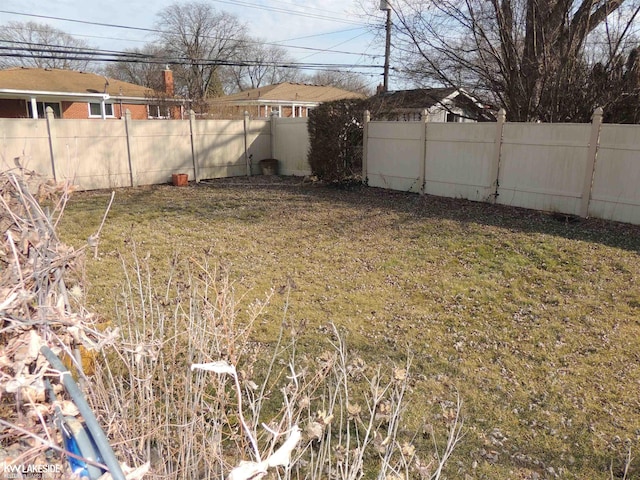 view of yard featuring a fenced backyard