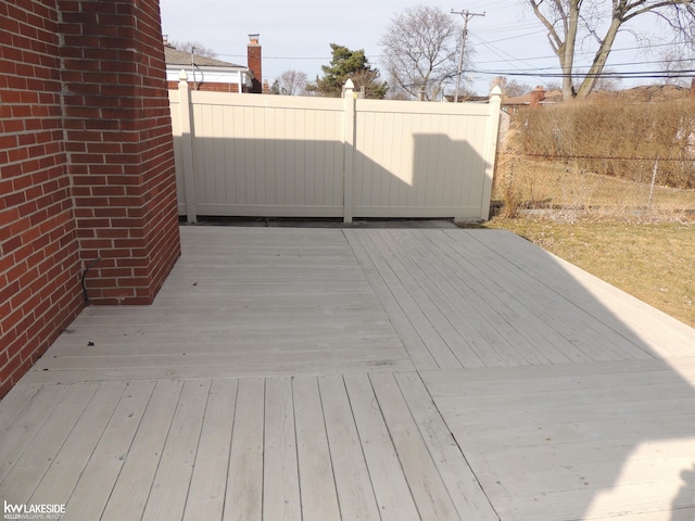 wooden deck featuring fence