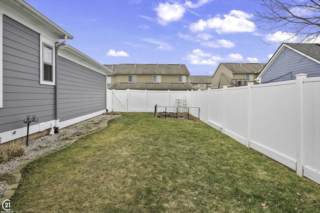 view of yard featuring a fenced backyard