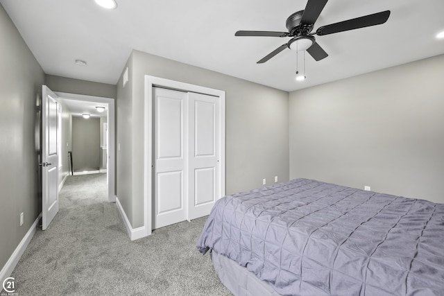 bedroom featuring carpet flooring, recessed lighting, baseboards, and a closet