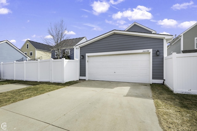 exterior space featuring driveway and fence